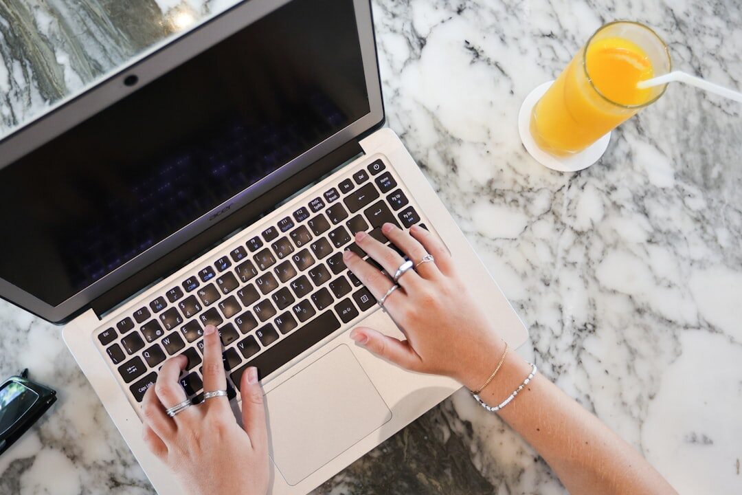 blogger writing on laptop